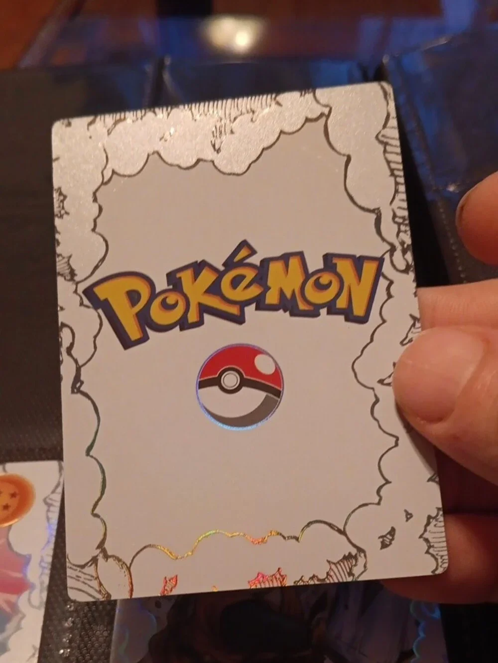 Pokemon Trading Card with Orange Dragon Ball Highlights